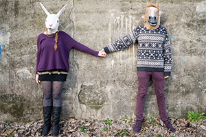 Couple wearing animal masks.