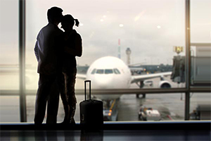 Couple saying "goodbye" at the airport.