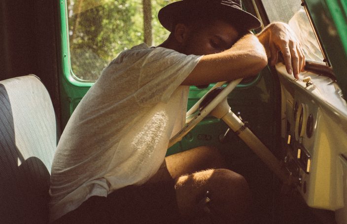 Man sitting alone in a car