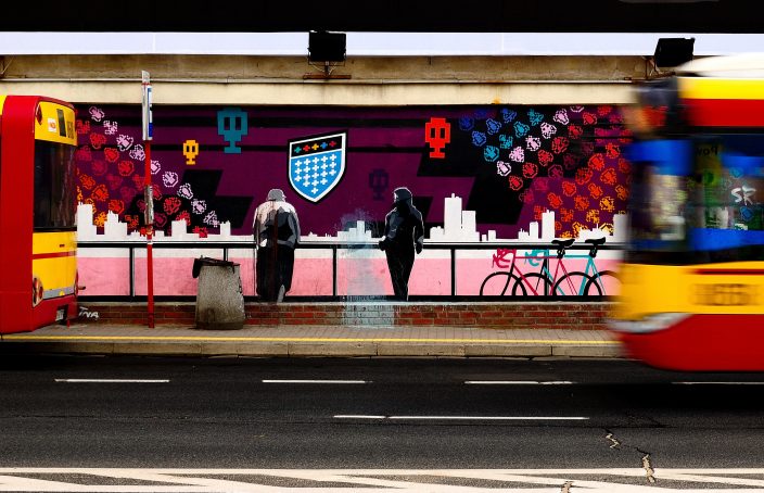 Graffiti couple at bus station.