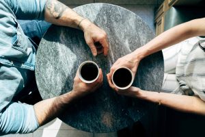 Two people having coffee together