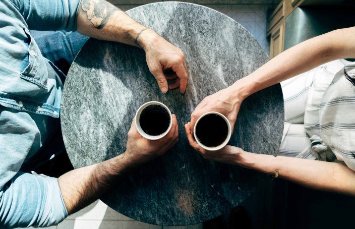 Two people having coffee together