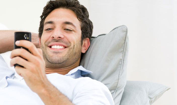 guy happy reading text message