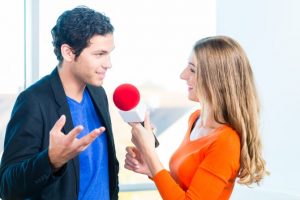 woman interviewing a man