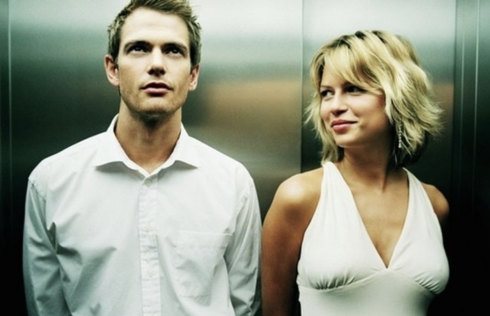 man and woman in elevator