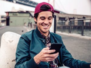 man on cell phone smiling